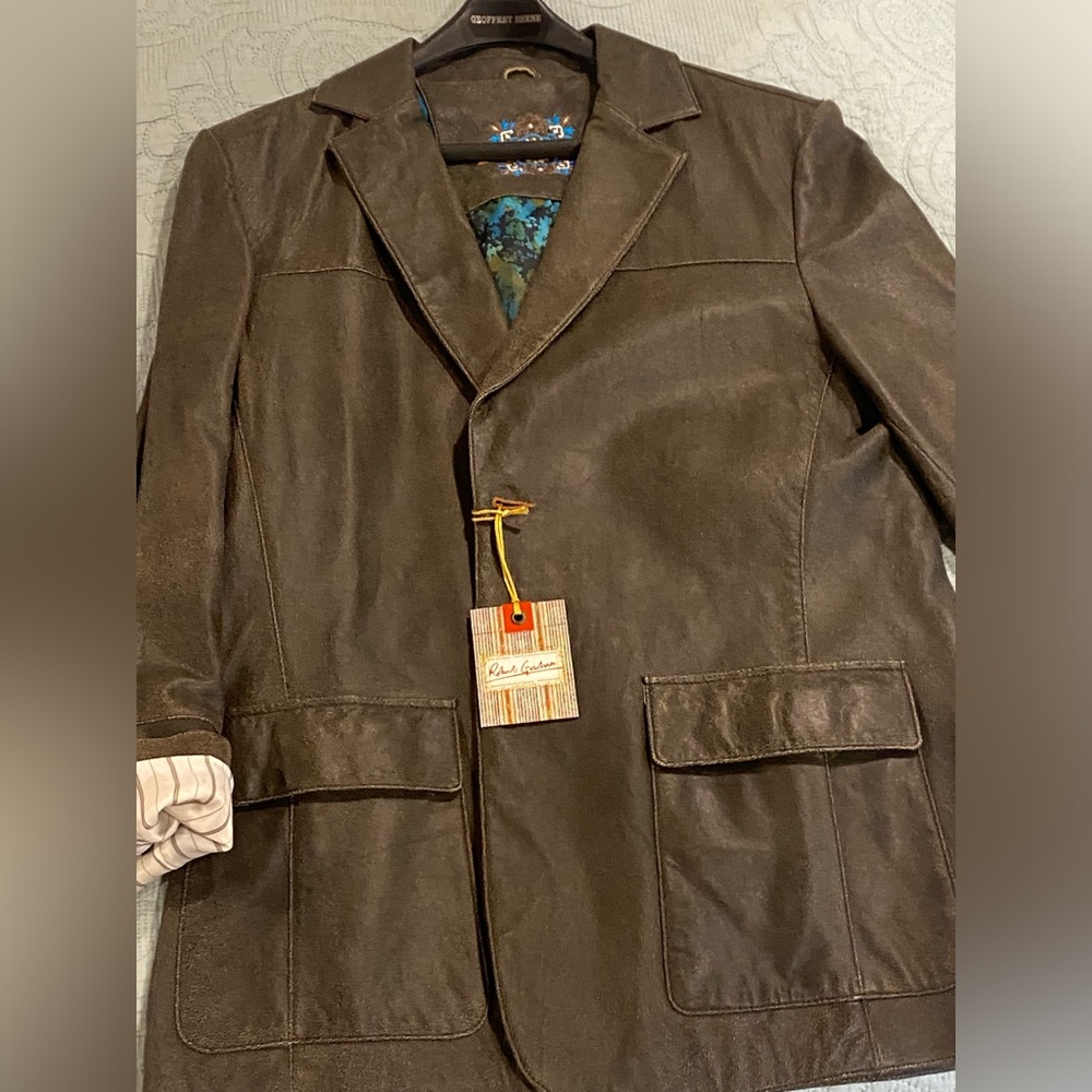 Luxury custom leather men’s jacket in black. Never worn, tags still on.